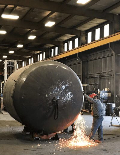 worker repairing a boiler